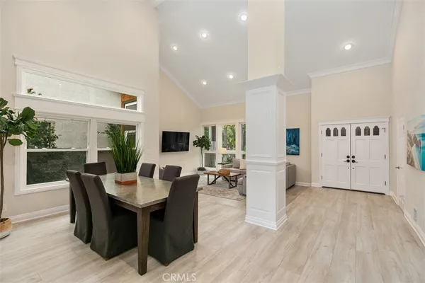 a view of a dining room with furniture window and wooden floor