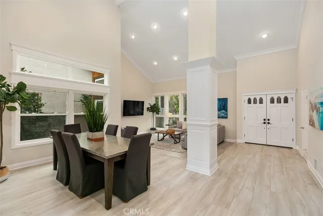 a view of a dining room with furniture window and wooden floor