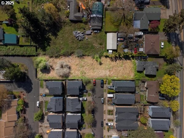 an aerial view of houses with outdoor space