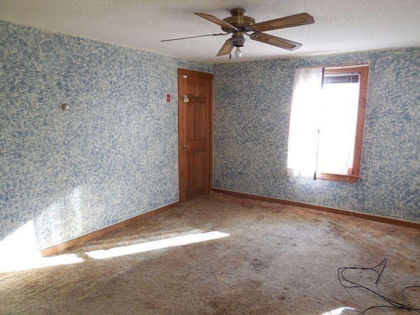 27 Upper Palmer Road Monson, MA 01057 - Photo 14 of 25 an empty room with windows and fan
