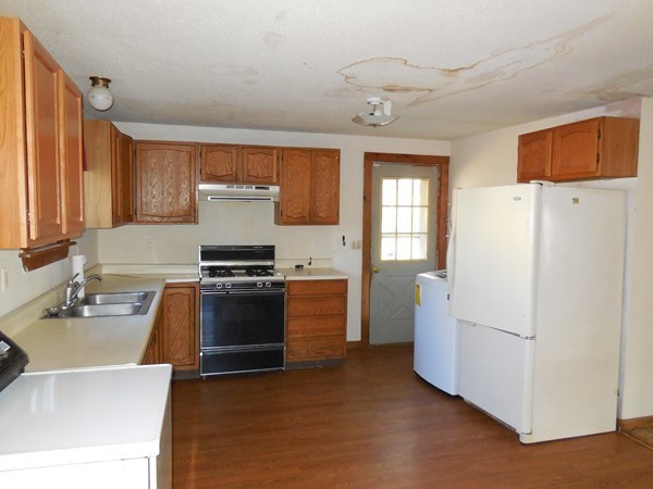 27 Upper Palmer Road Monson, MA 01057 - Photo 10 of 25 a kitchen with a refrigerator sink and stove