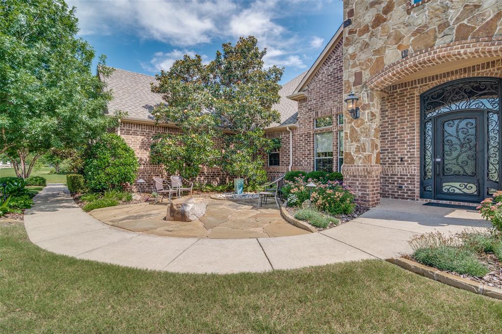 1107 Bayside Drive St. Paul, TX 75098 - Photo 1 of 36 Front entrance with courtyard and water feature