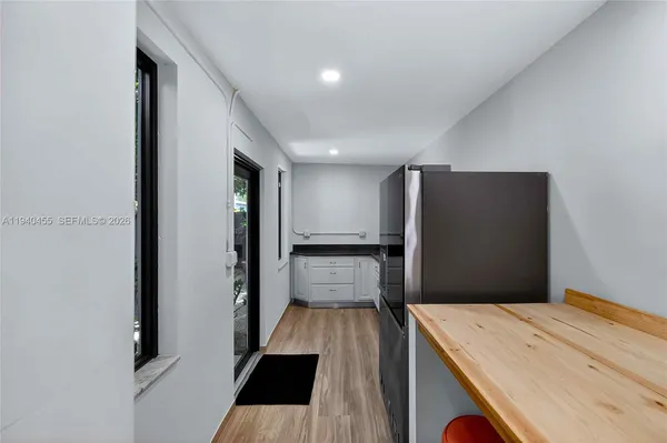 a view of kitchen island with wooden floor