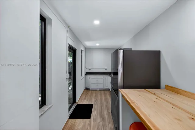 a view of kitchen island with wooden floor