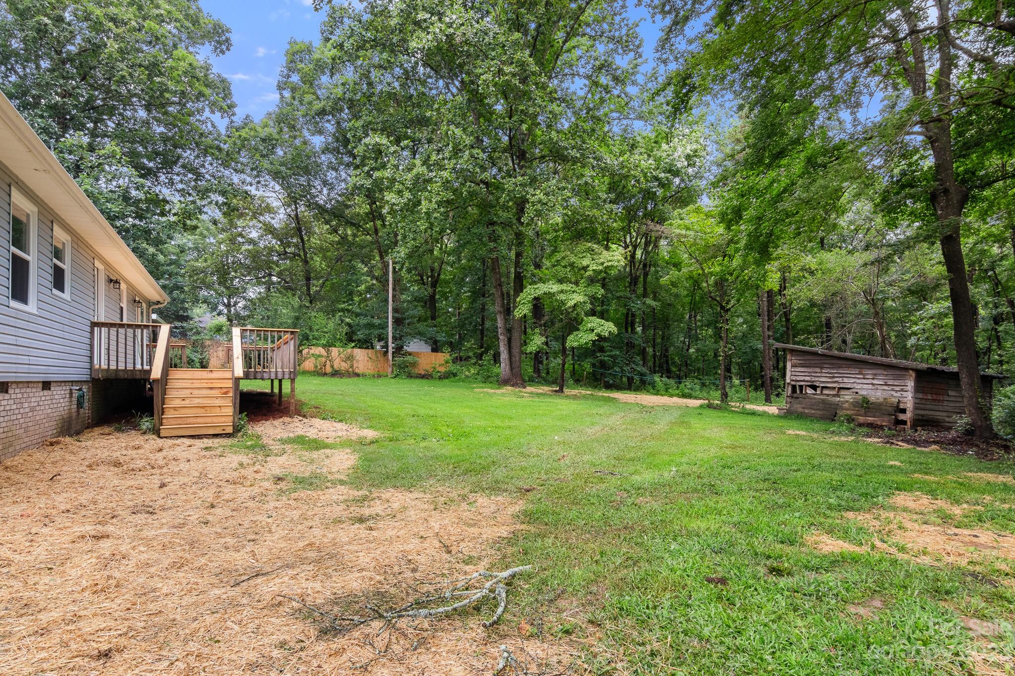 204 West Sandy Ridge Road Monroe, NC 28112 - Photo 31 of 33 a view of a house with backyard and sitting area