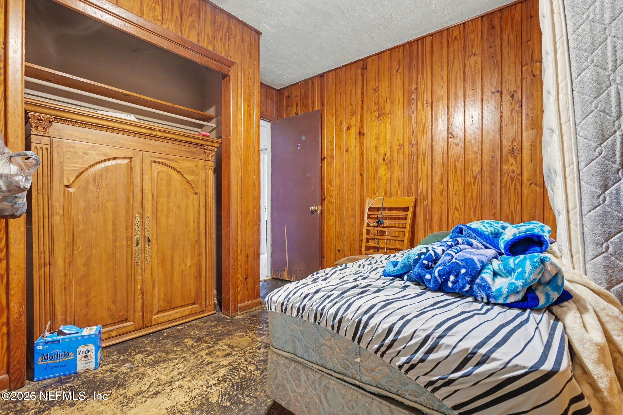 1826 Leon Road Jacksonville, FL 32246 - Photo 12 of 23 a bedroom with a bed and a window