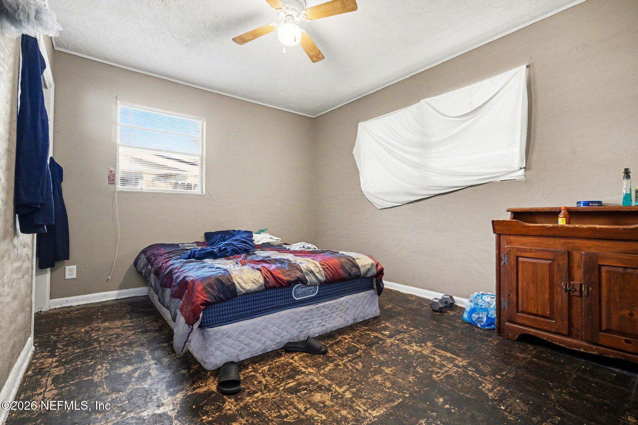 1826 Leon Road Jacksonville, FL 32246 - Photo 13 of 23 a bedroom with a bed and dresser