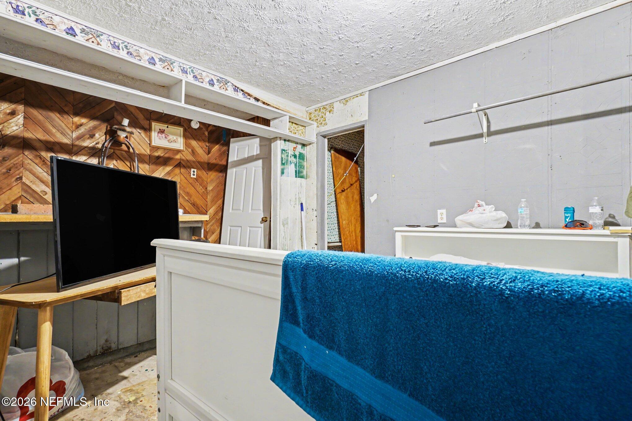 1826 Leon Road Jacksonville, FL 32246 - Photo 17 of 23 a kitchen with a stove a refrigerator and a dining table