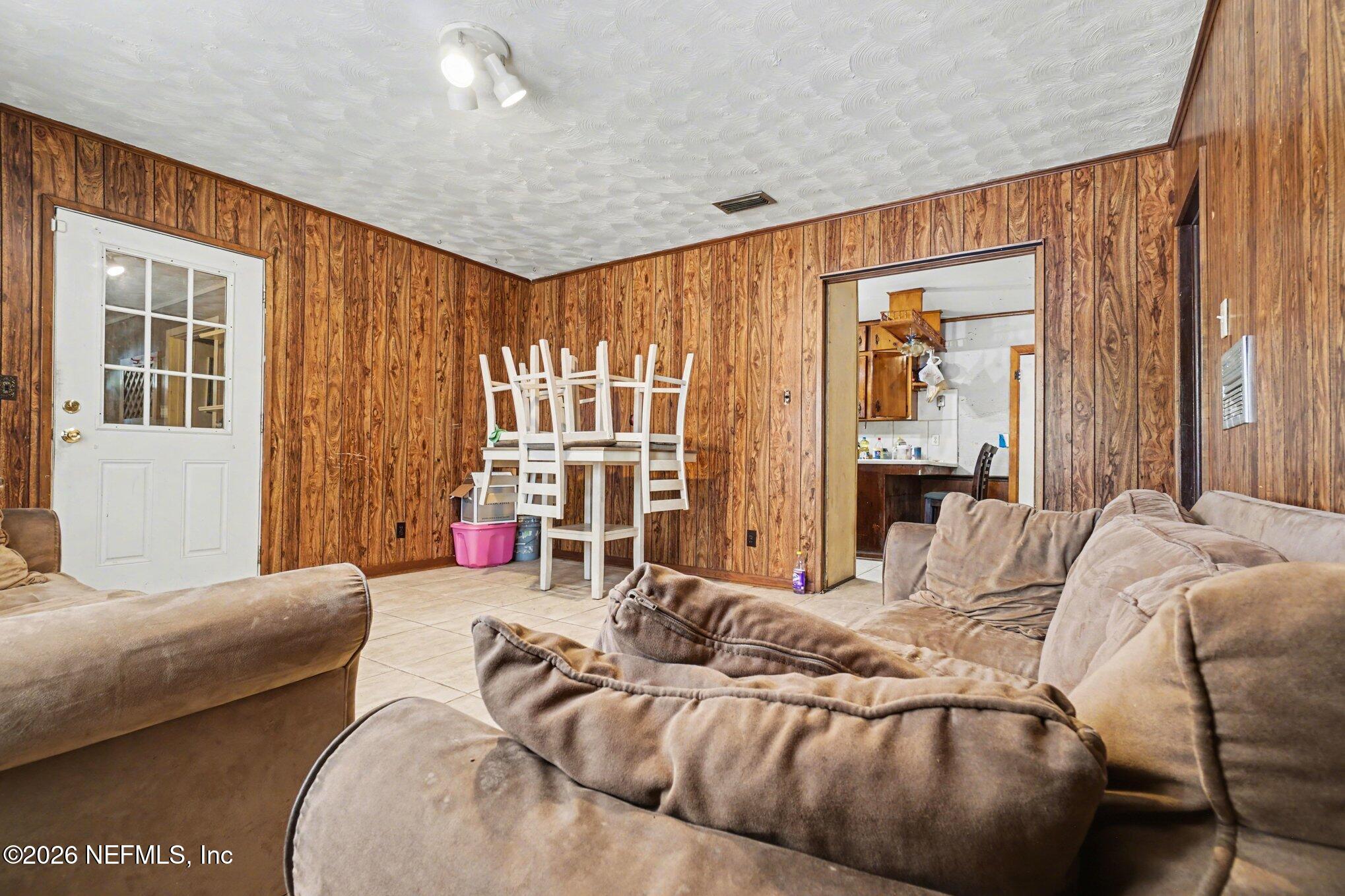 1826 Leon Road Jacksonville, FL 32246 - Photo 4 of 23 a bedroom with furniture and a large window