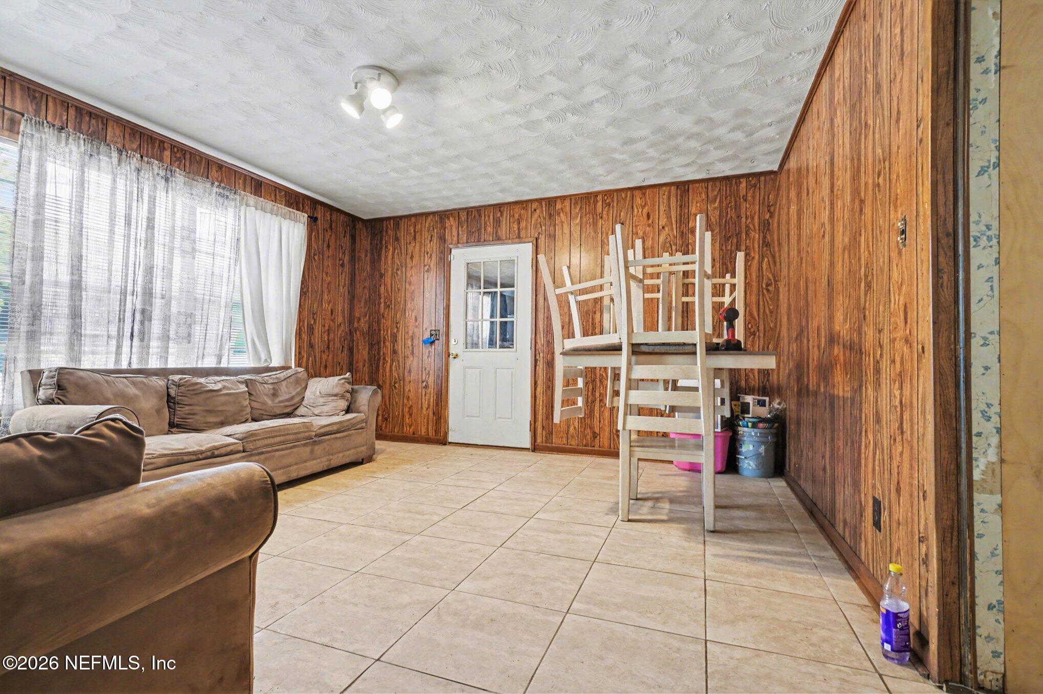 1826 Leon Road Jacksonville, FL 32246 - Photo 5 of 23 a living room with furniture and a large window