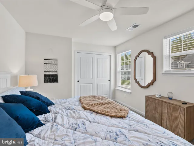 a bathroom with a sink toilet a mirror and shower