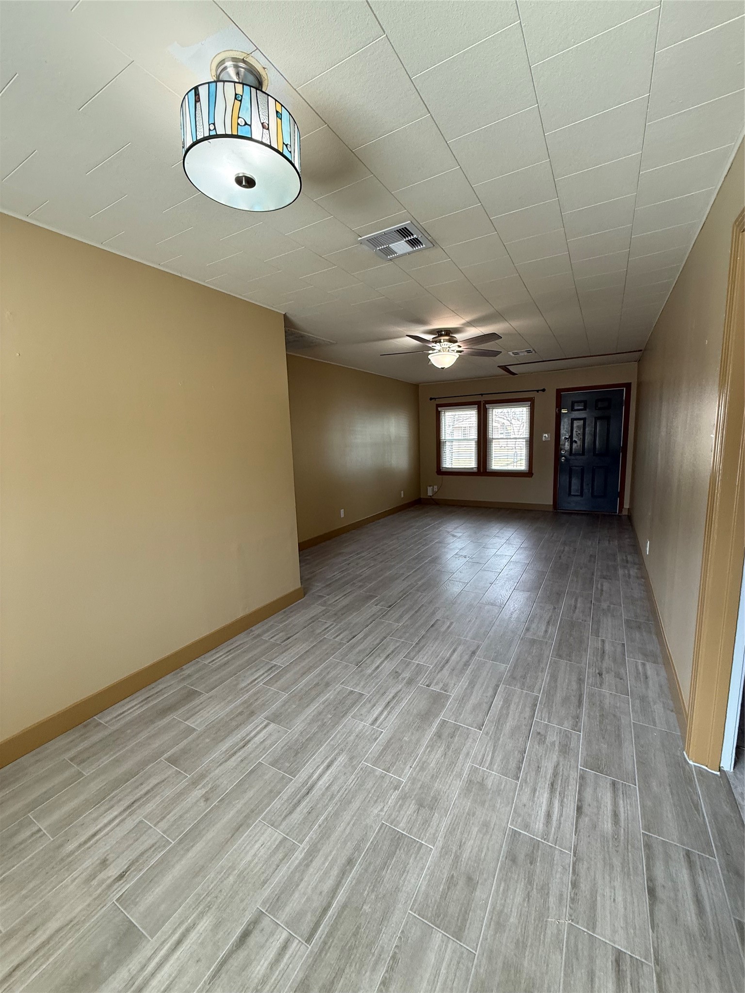 706 Alice Street Sweeny, TX 77480 - Photo 2 of 8 a view of wooden floor and window in a room