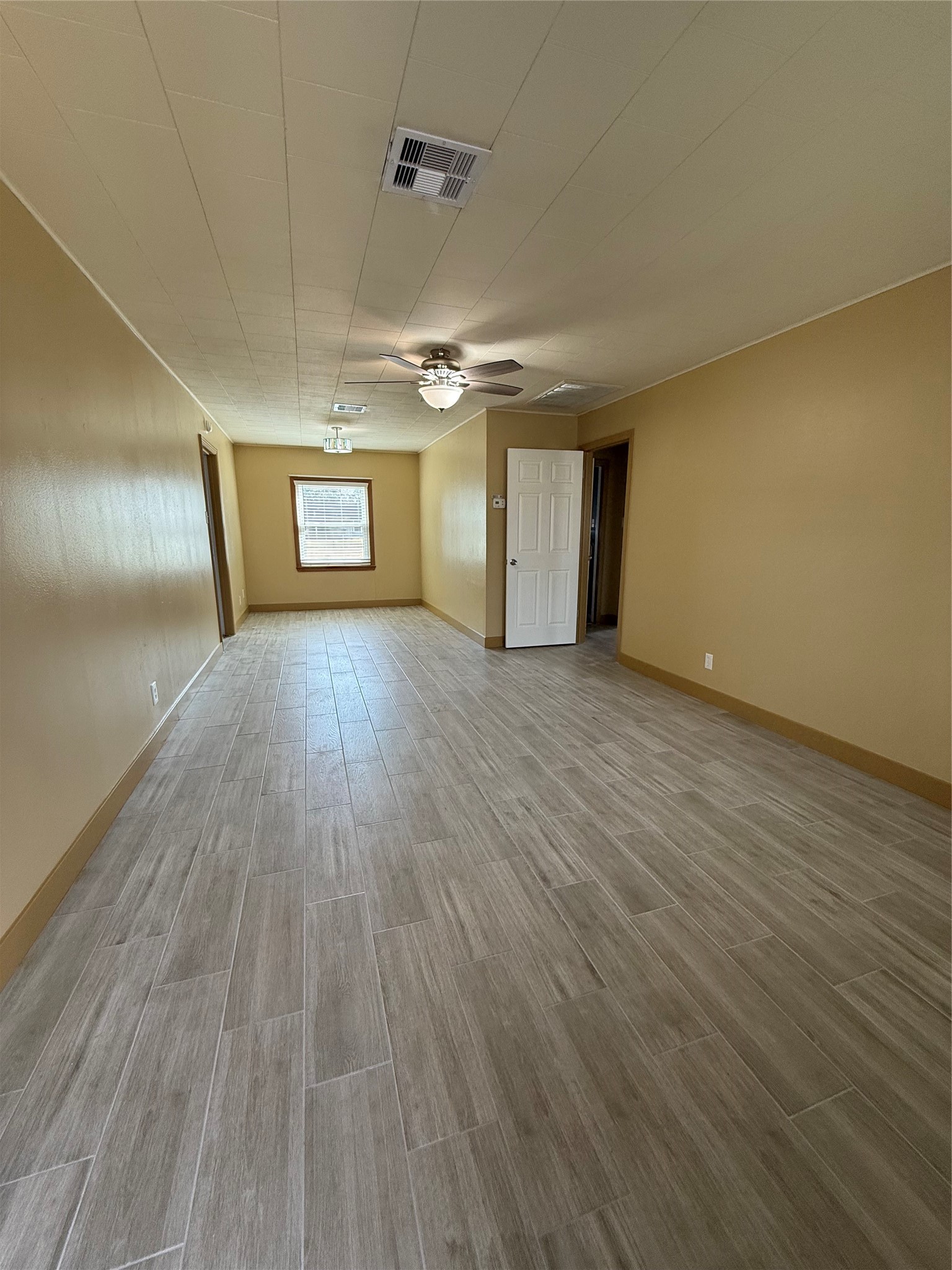 706 Alice Street Sweeny, TX 77480 - Photo 3 of 8 a view of a room with wooden floor
