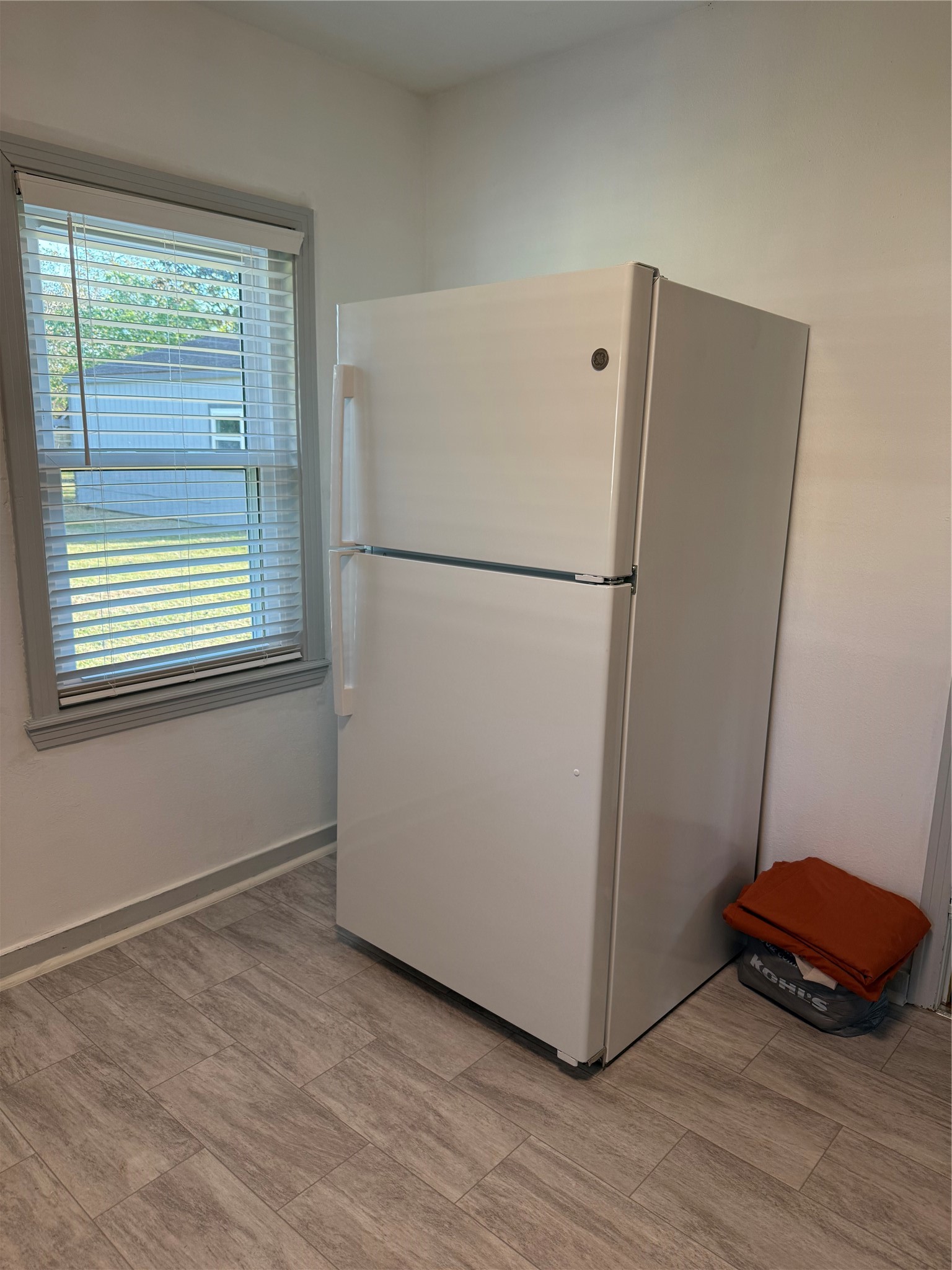706 Alice Street Sweeny, TX 77480 - Photo 6 of 8 a view of a room with wooden floor and cabinet