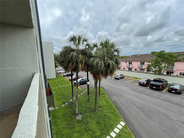 a view of yard with car parked