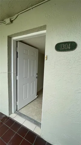 a view of a hallway with wooden shelves