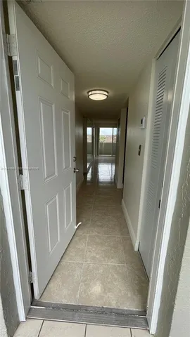 a view of a kitchen with a sink