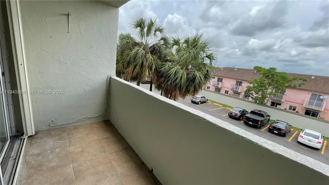a view of a porch with furniture and a yard