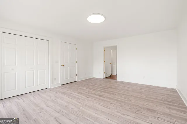 a view of a kitchen with a sink and windows