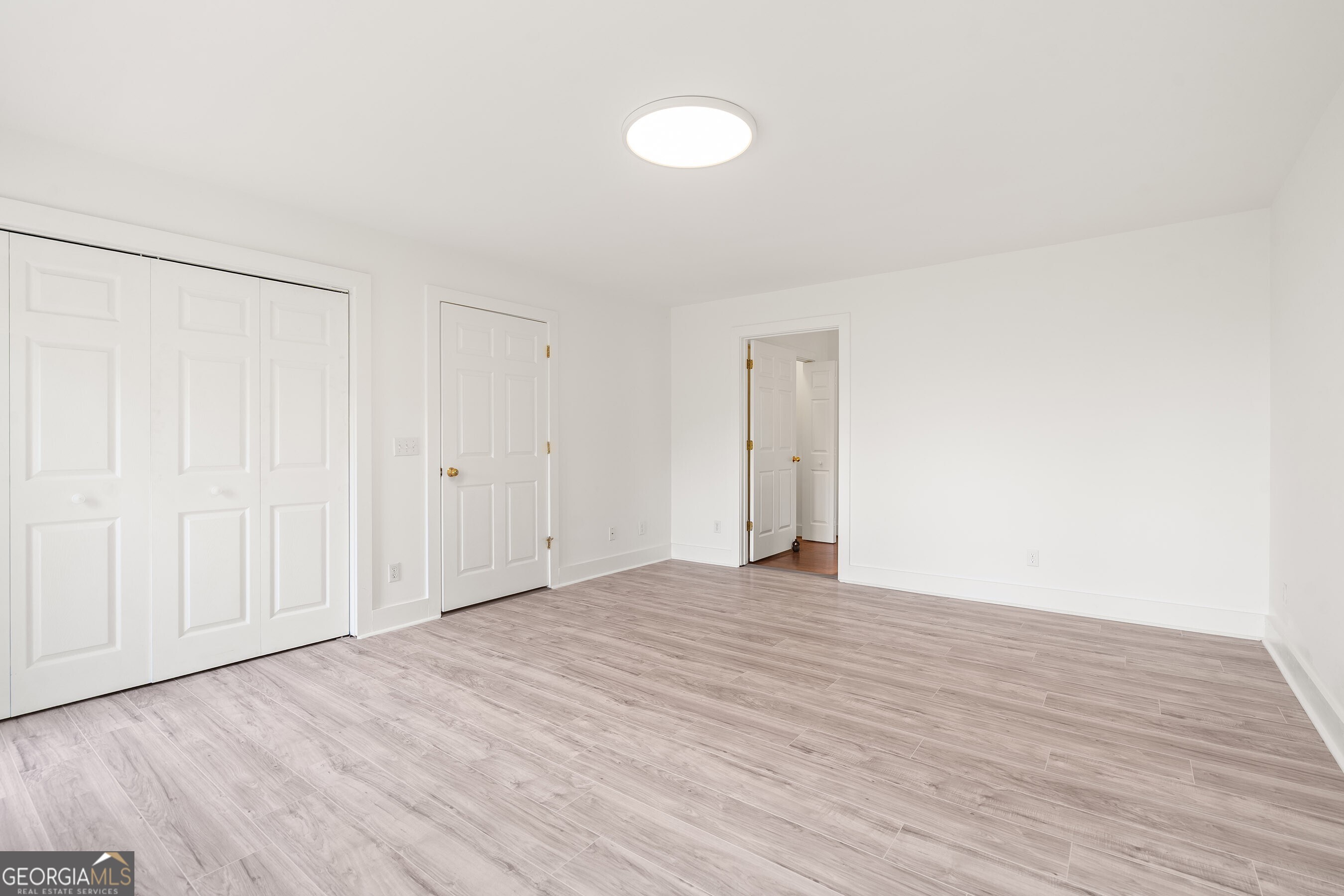 832 Round Top Drive Clayton, GA 30525 - Photo 18 of 42 a view of an empty room with wooden floor