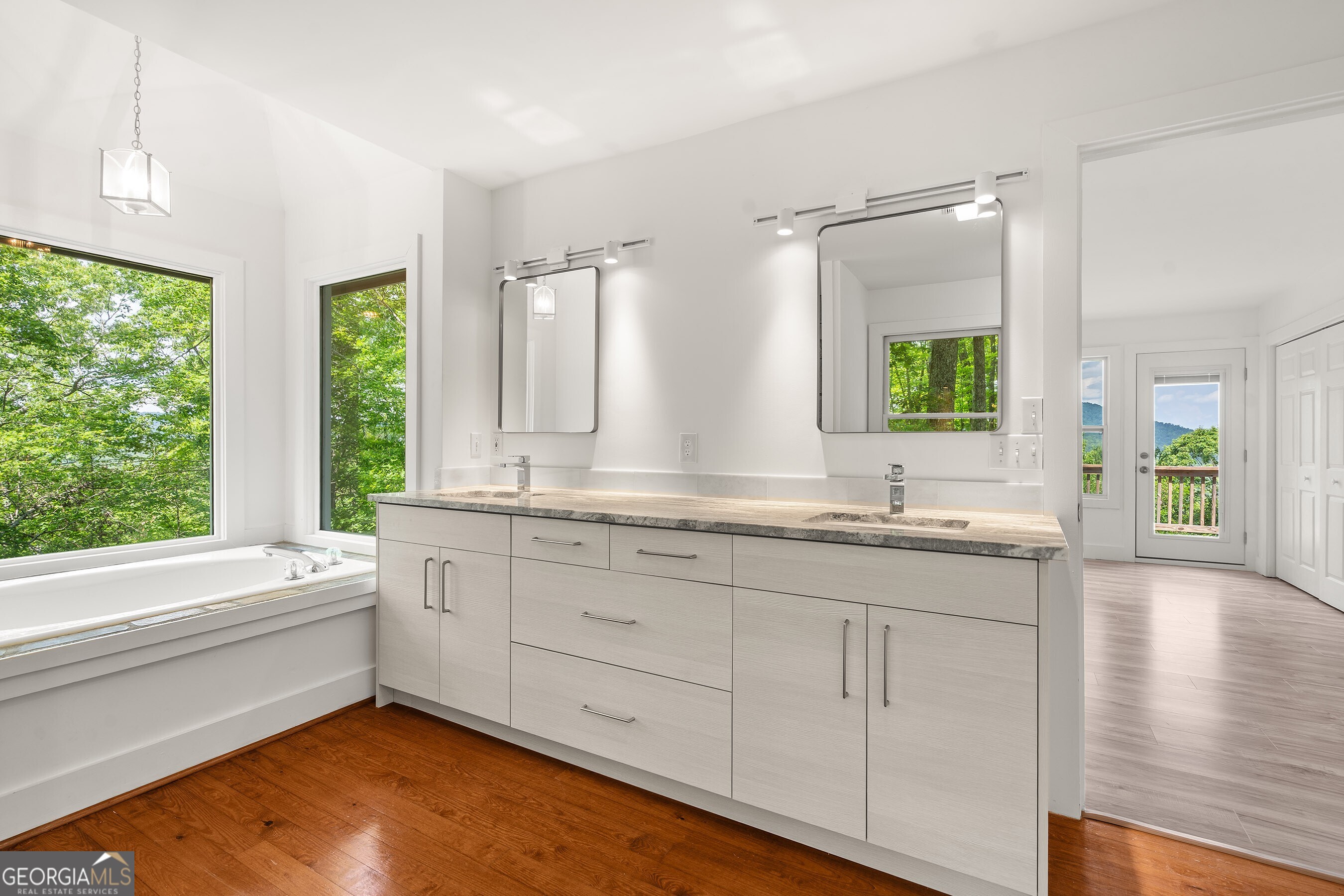 832 Round Top Drive Clayton, GA 30525 - Photo 20 of 42 a bathroom with a granite countertop sink and a large mirror