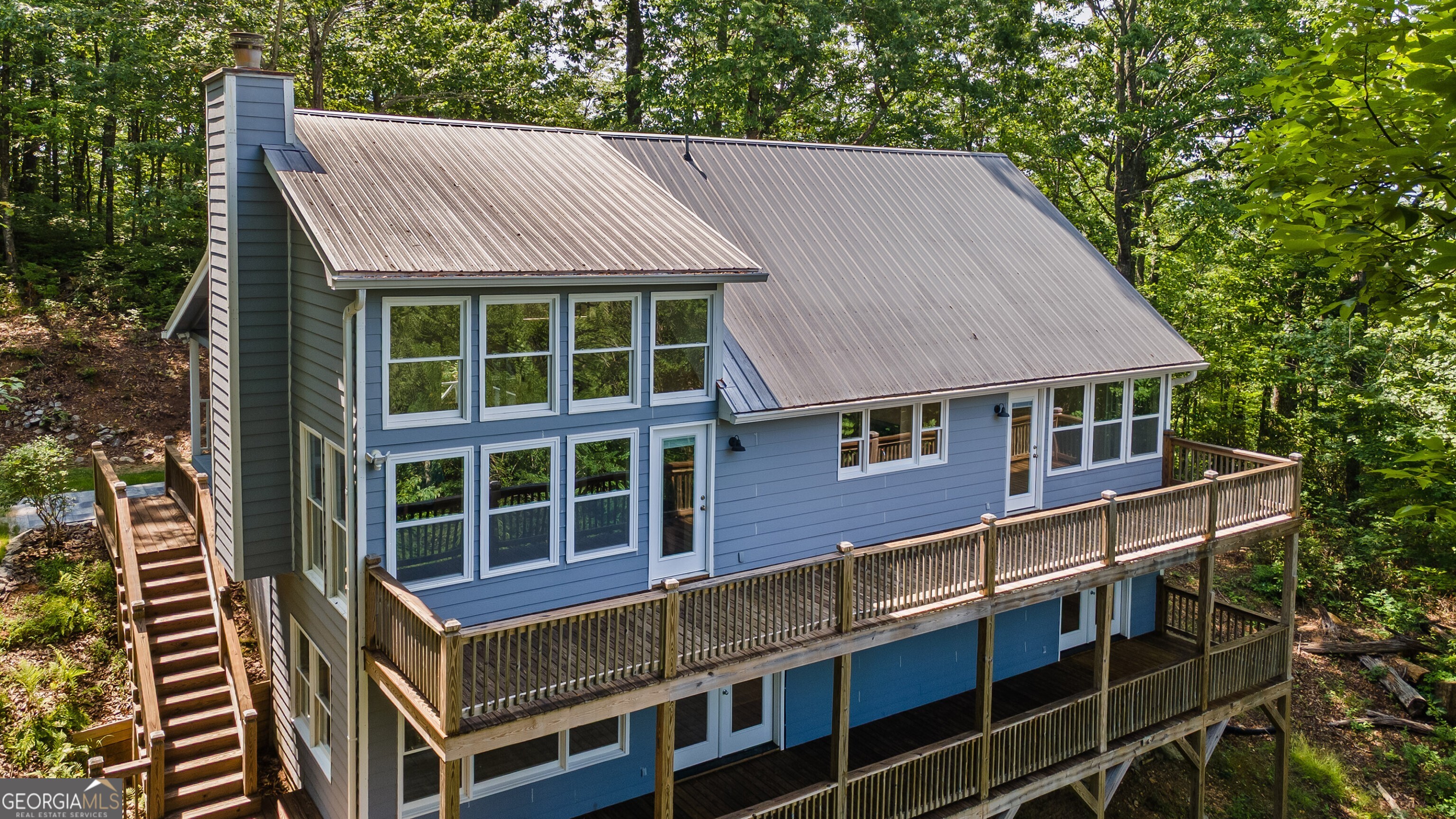 832 Round Top Drive Clayton, GA 30525 - Photo 3 of 42 a front view of a house with a yard