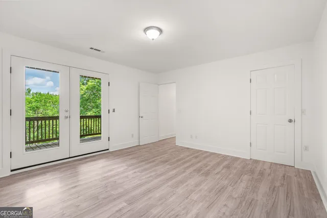 a view of a balcony with wooden floor