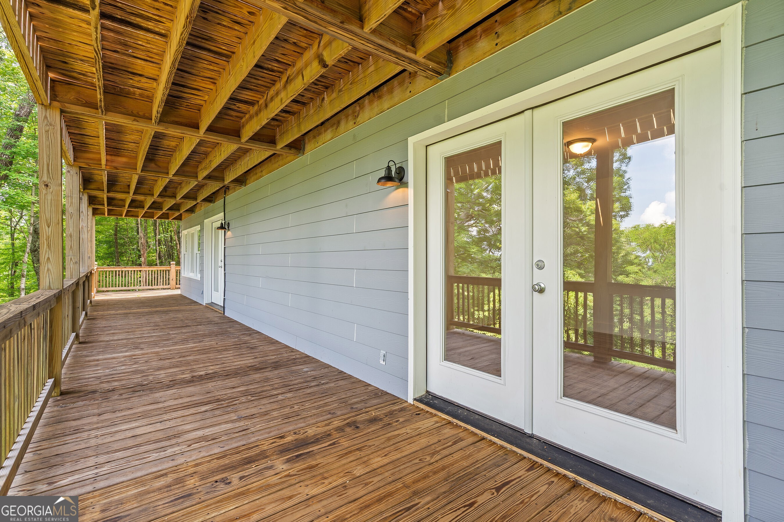 832 Round Top Drive Clayton, GA 30525 - Photo 33 of 42 a view of a balcony with wooden floor