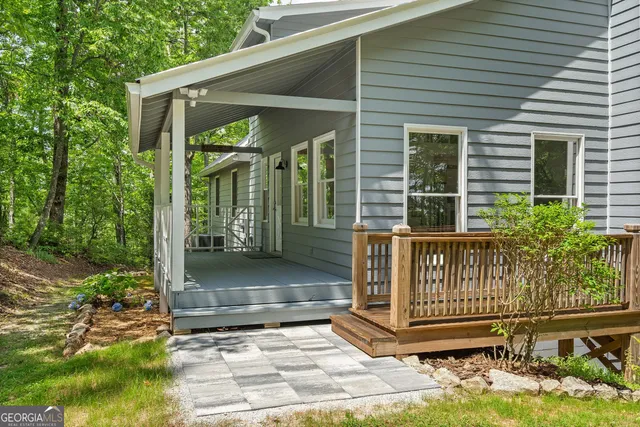 a view of a house with a bed and a patio