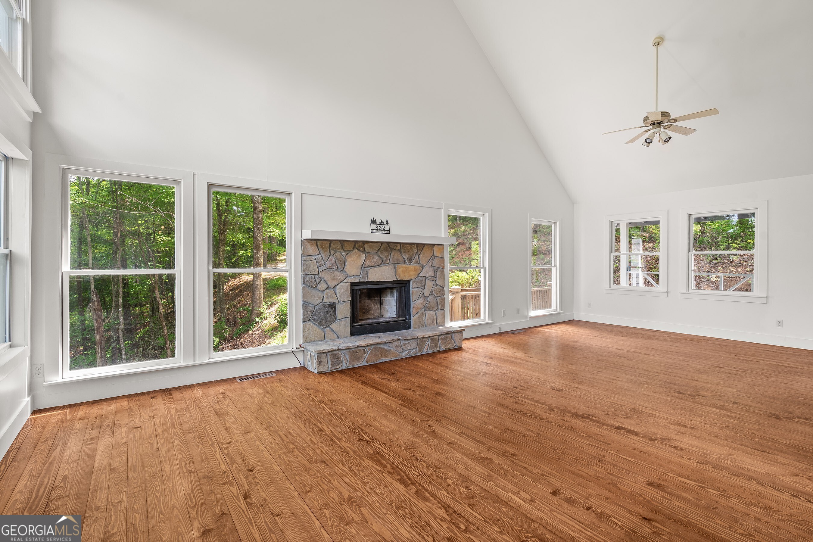832 Round Top Drive Clayton, GA 30525 - Photo 9 of 42 a view of an empty room with a window and fireplace
