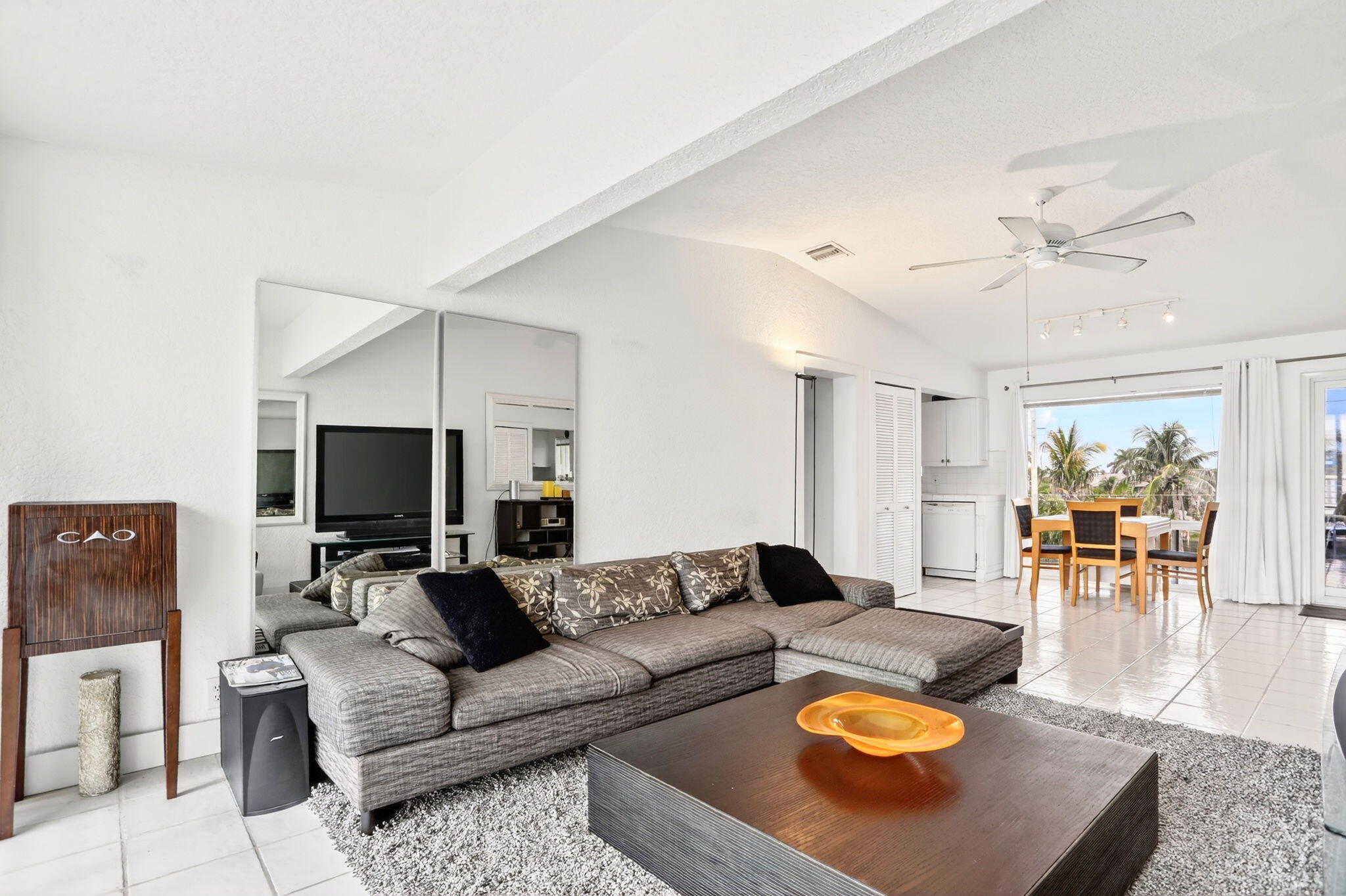 1043 Hillsboro Mile, Unit 22C Hillsboro Beach, FL 33062 - Photo 12 of 53 a living room with furniture and a flat screen tv