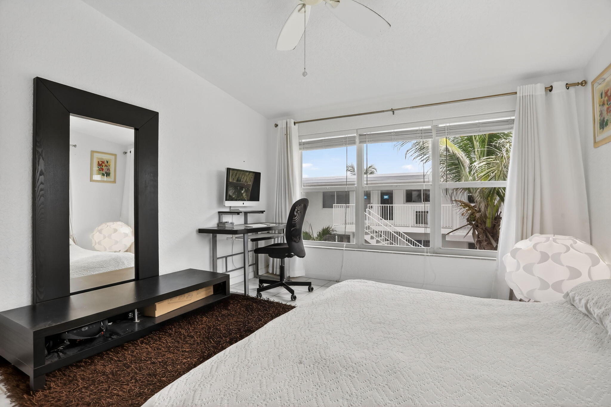 1043 Hillsboro Mile, Unit 22C Hillsboro Beach, FL 33062 - Photo 15 of 53 a bedroom with furniture and a window