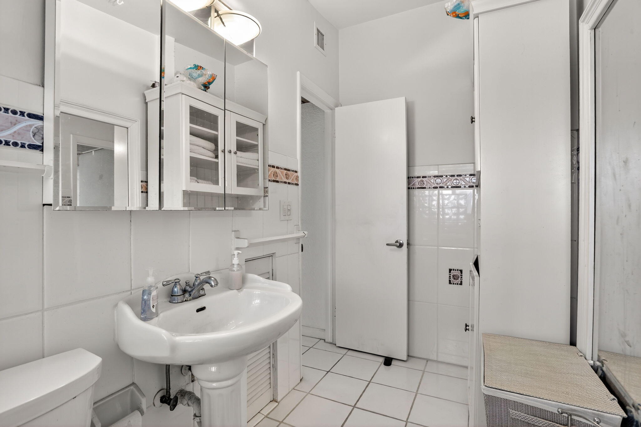 1043 Hillsboro Mile, Unit 22C Hillsboro Beach, FL 33062 - Photo 18 of 53 a bathroom with a sink a toilet and shower