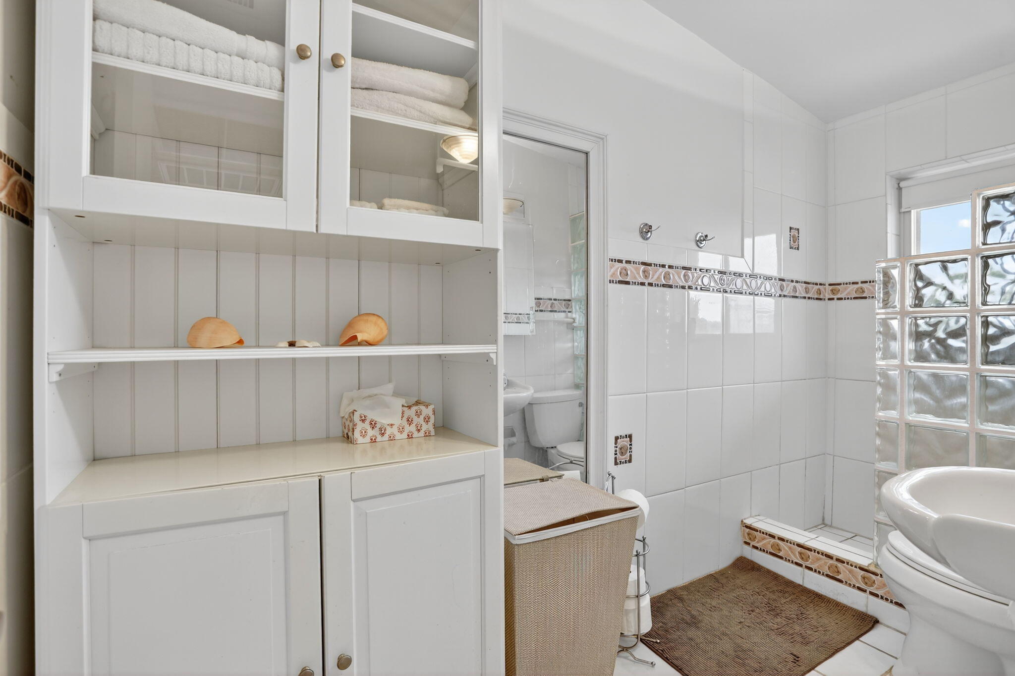 1043 Hillsboro Mile, Unit 22C Hillsboro Beach, FL 33062 - Photo 19 of 53 a room with a cabinets and washer