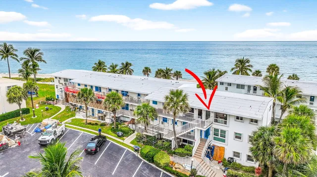 a view of an apartment with a garden