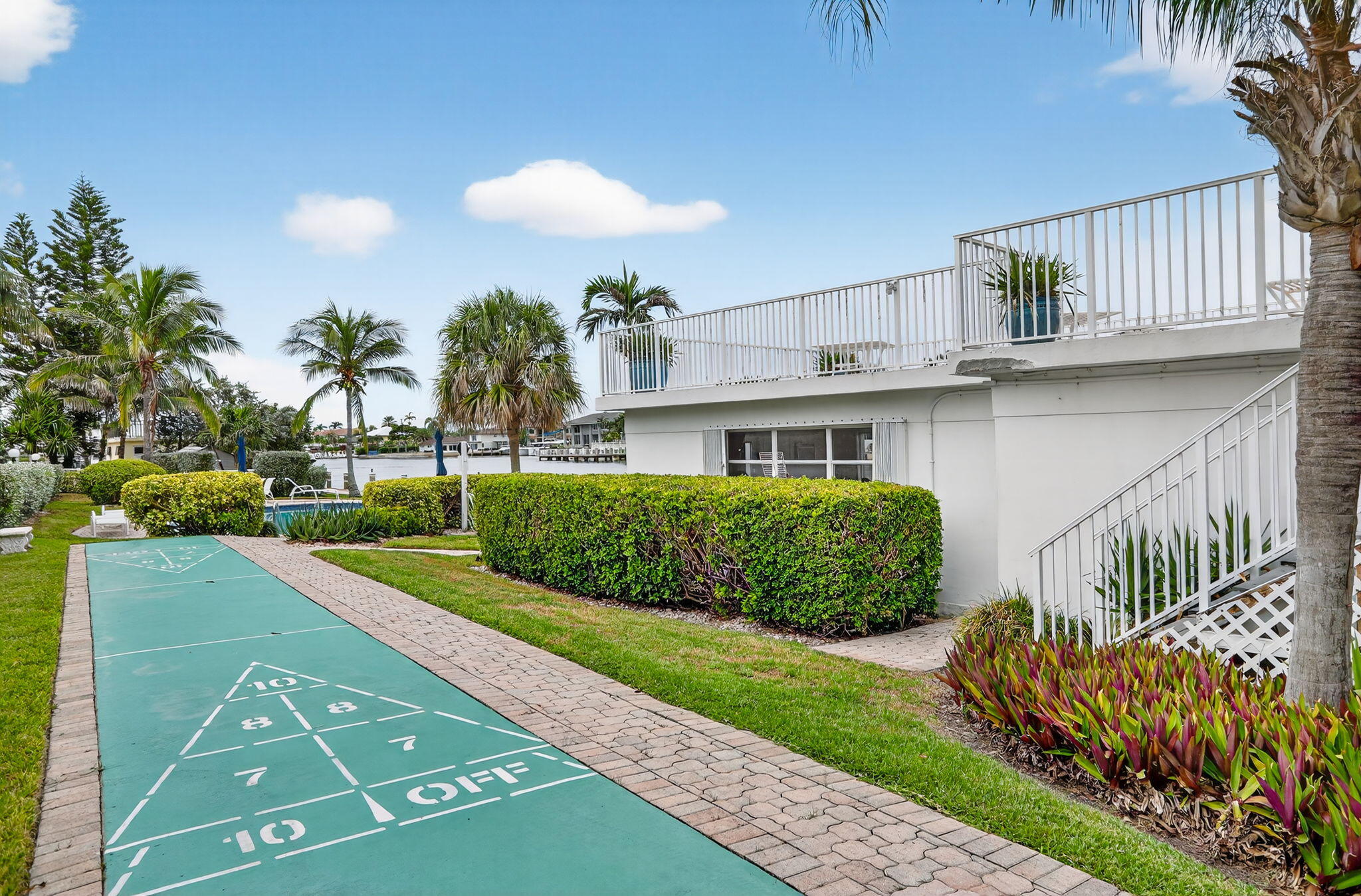 1043 Hillsboro Mile, Unit 22C Hillsboro Beach, FL 33062 - Photo 27 of 53 a front view of a house with a yard