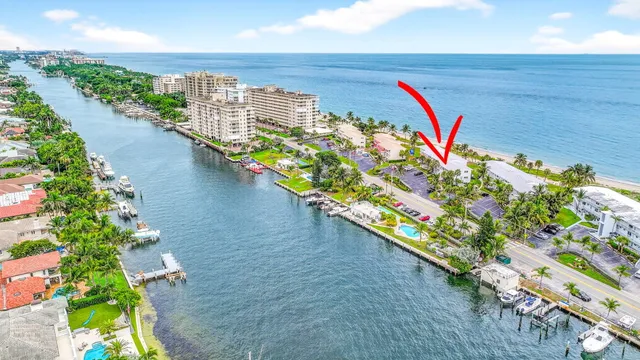 a view of a multi story yard with an ocean