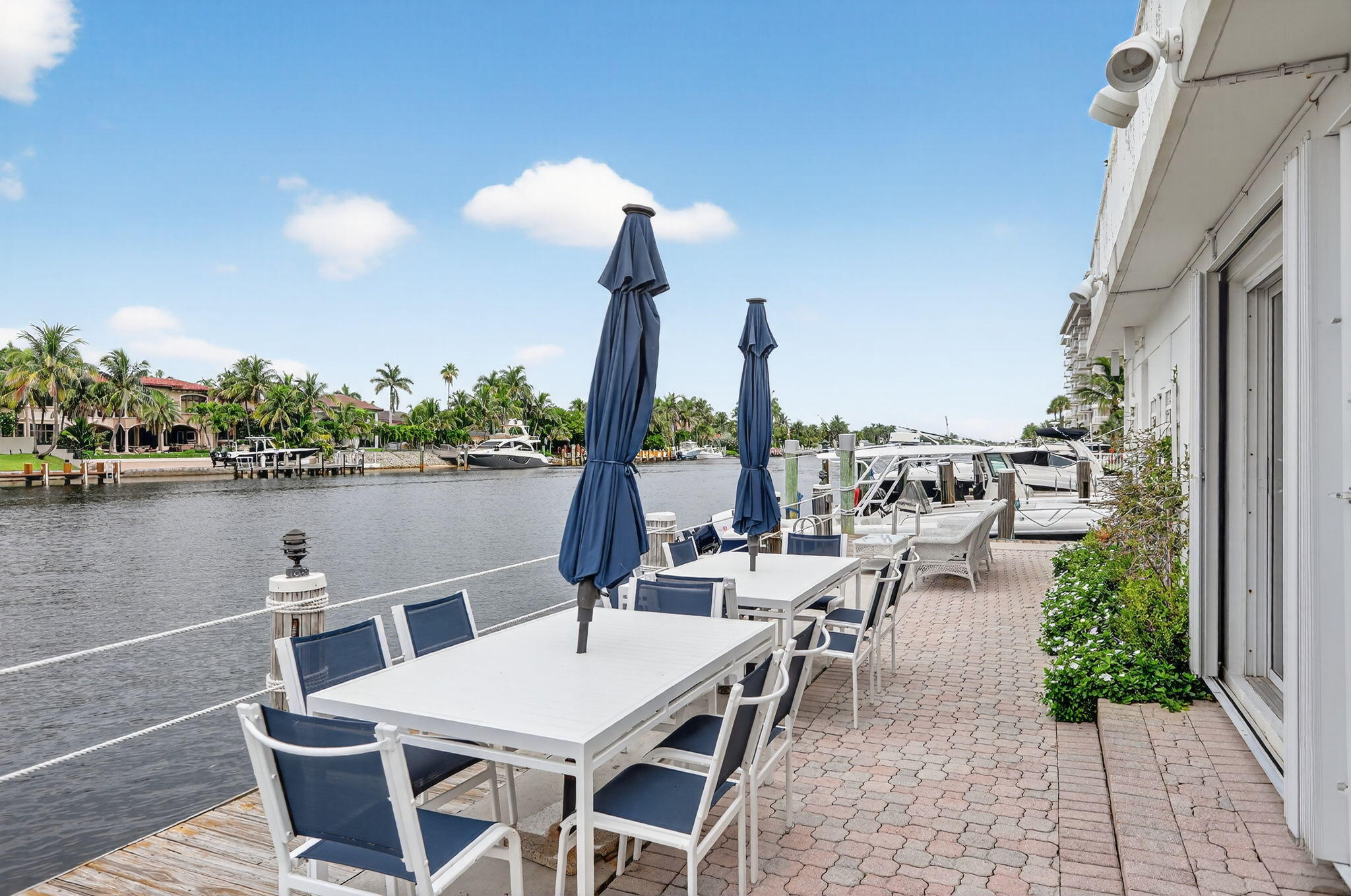 1043 Hillsboro Mile, Unit 22C Hillsboro Beach, FL 33062 - Photo 40 of 53 a view of a patio with chairs and table on the terrace