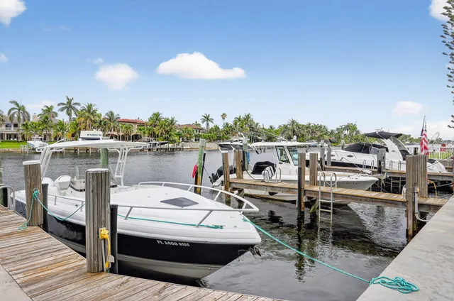 a view of a terrace with furniture and a garden