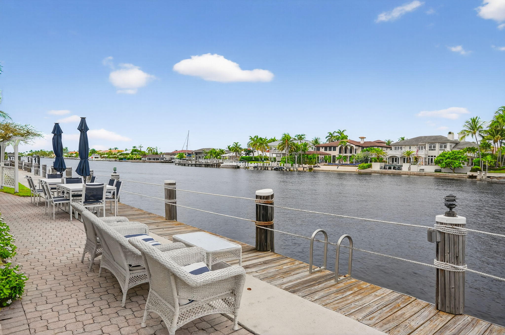 1043 Hillsboro Mile, Unit 22C Hillsboro Beach, FL 33062 - Photo 42 of 53 a terrace with a table and chairs