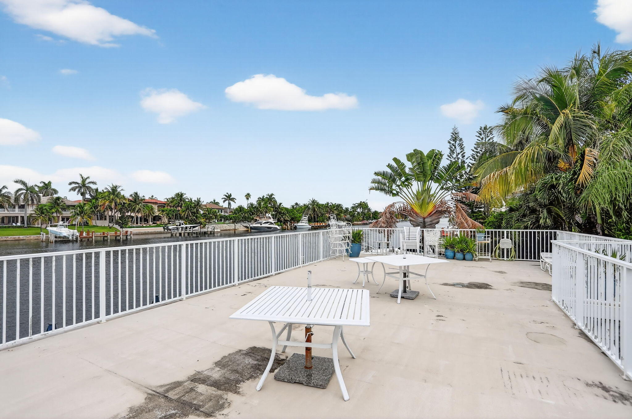 1043 Hillsboro Mile, Unit 22C Hillsboro Beach, FL 33062 - Photo 44 of 53 a view of a terrace with furniture and a garden