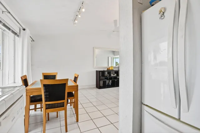 a kitchen with a sink cabinets and window