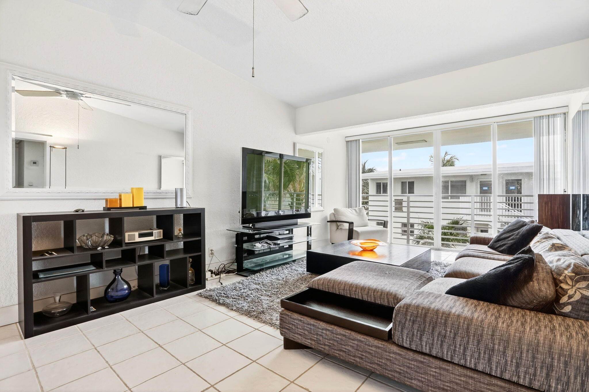1043 Hillsboro Mile, Unit 22C Hillsboro Beach, FL 33062 - Photo 9 of 53 a living room with furniture and a flat screen tv