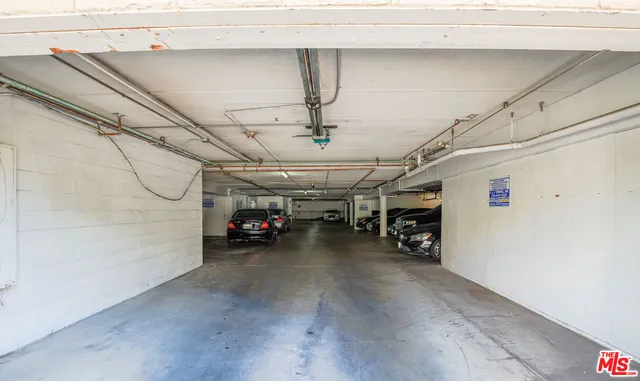 a view of a garage with cars