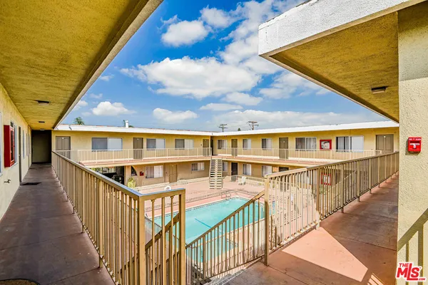 a view of a house with pool and stairs