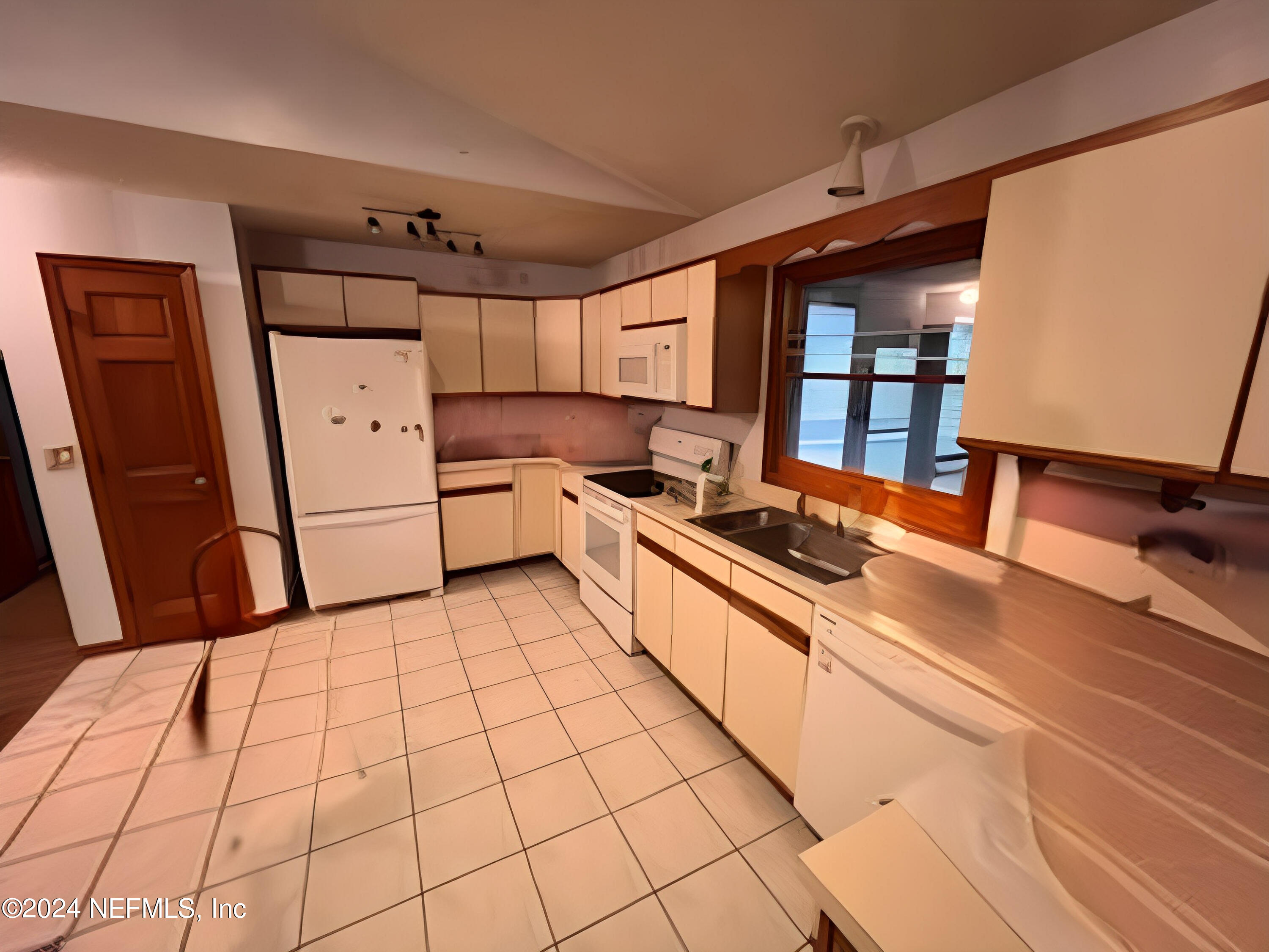 29 Sea Oaks Drive St. Augustine, FL 32080 - Photo 2 of 5 a kitchen with stainless steel appliances a refrigerator sink and cabinets