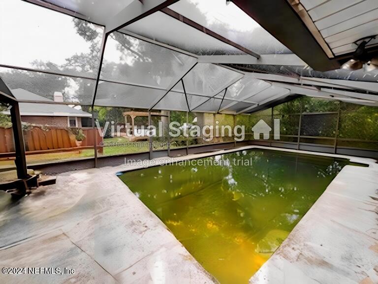 29 Sea Oaks Drive St. Augustine, FL 32080 - Photo 5 of 5 a view of a swimming pool with a patio