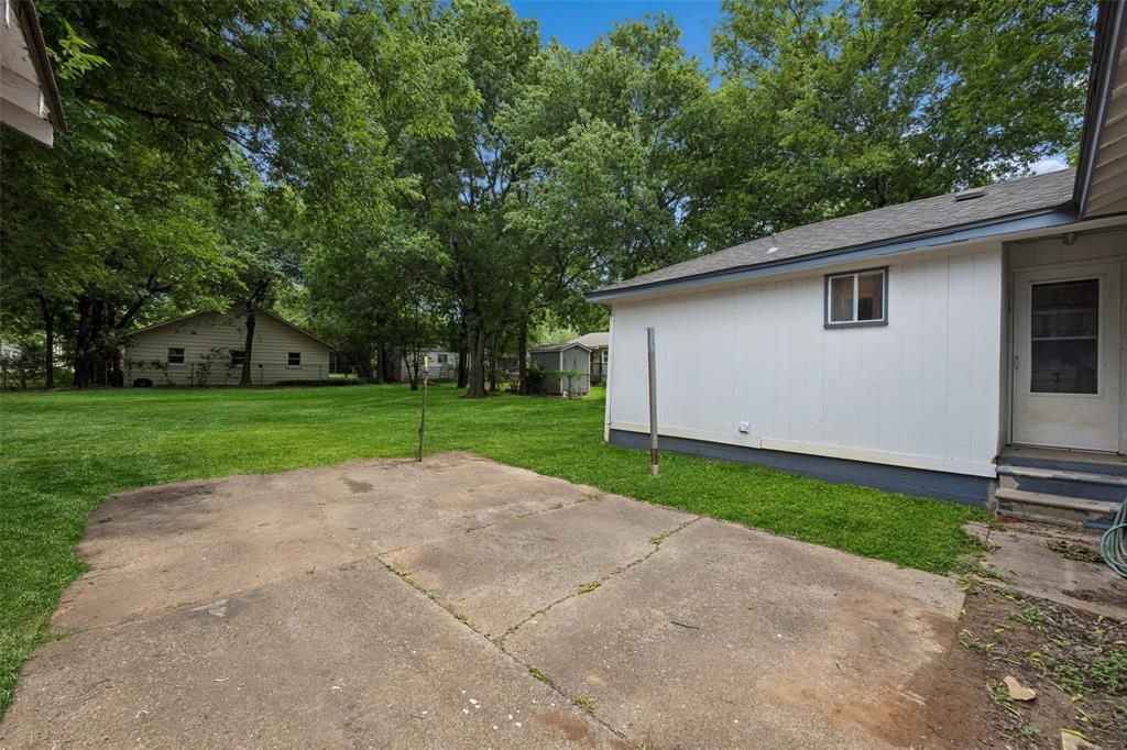 117 Moon Street Cleburne, TX 76033 - Photo 24 of 28 a view of a house with backyard