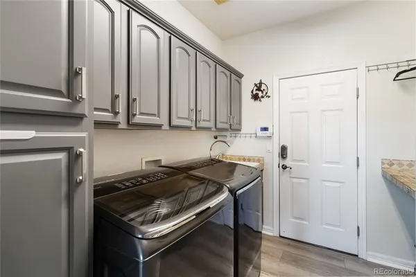 a kitchen with stainless steel appliances a stove a sink and a refrigerator