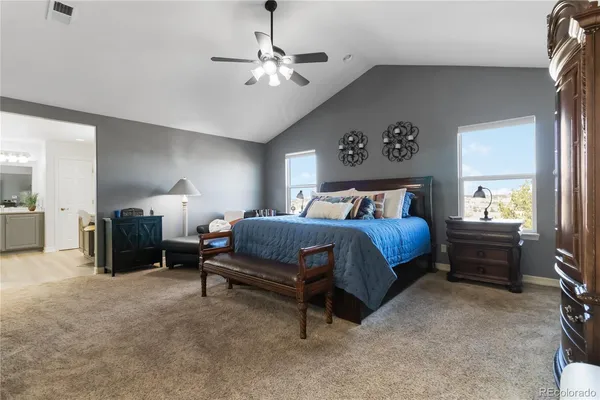 a bedroom with bed and window